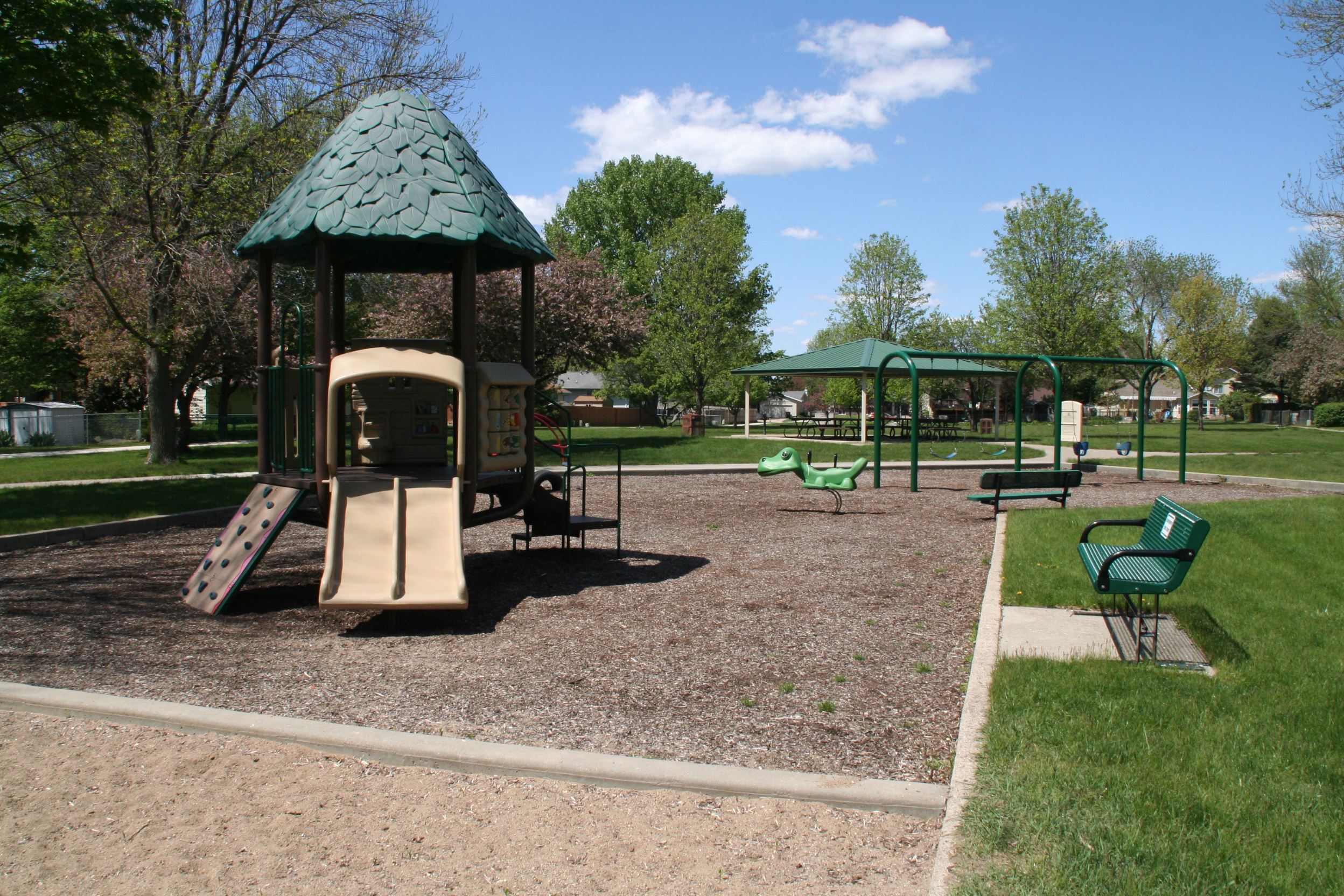 Village Park playground equipment and bench